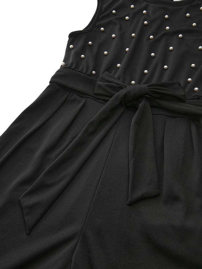 Combinaison noire à nœud et perles avec ceinture années 1950