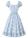 Robe bleu clair motif marguerites et décolleté cœur années 50