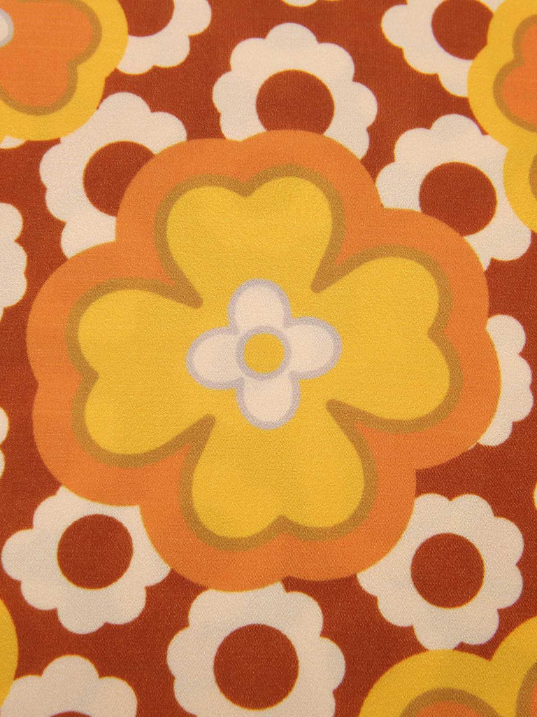 Haut sans manches à col noué et motif floral vert des années 1960