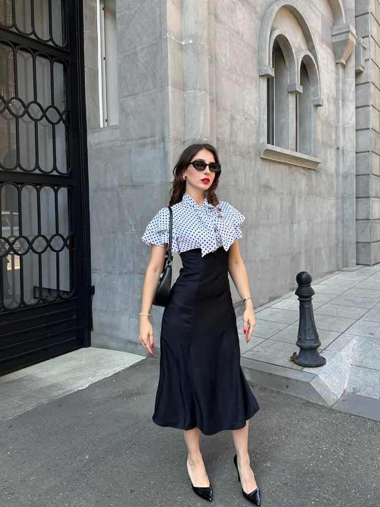 Robe sirène noire à pois et col noué des années 1930