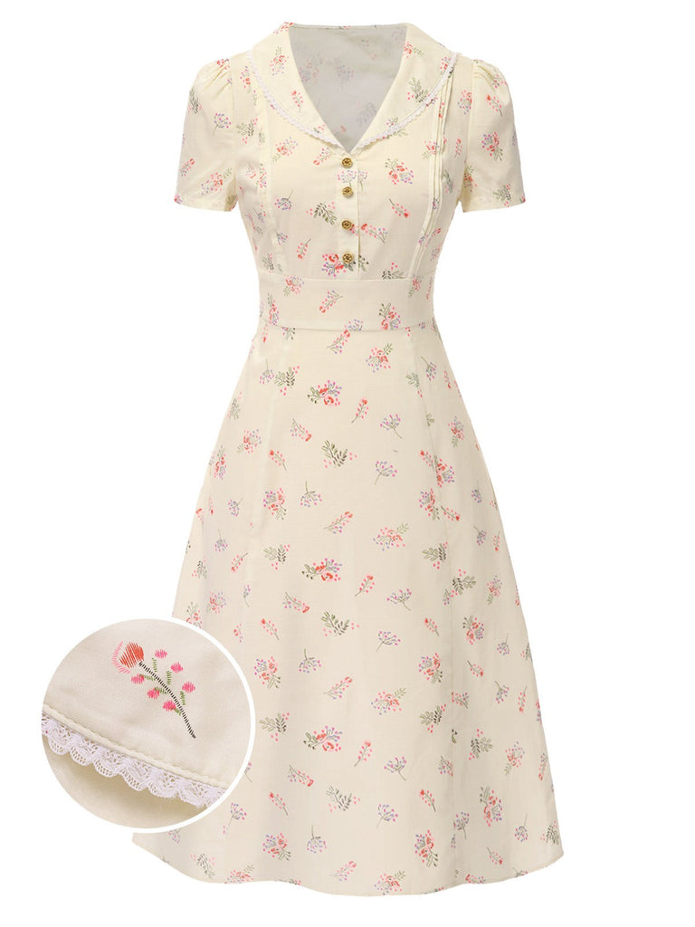 Robe beige à manches bouffantes et revers fleuris des années 1940