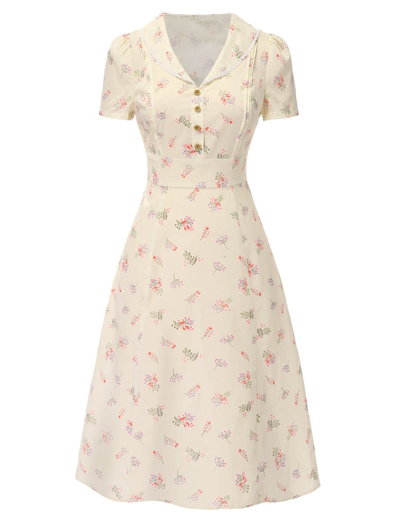 Robe beige à manches bouffantes et revers fleuris des années 1940