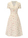 Robe beige à manches bouffantes et revers fleuris des années 1940