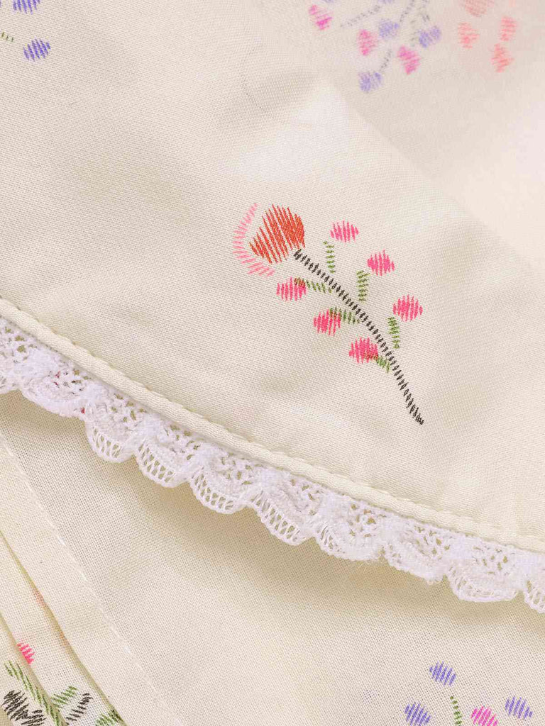 Robe beige à manches bouffantes et revers fleuris des années 1940