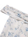 Robe bleue à volants et épaules dénudées motif floral des années 1930