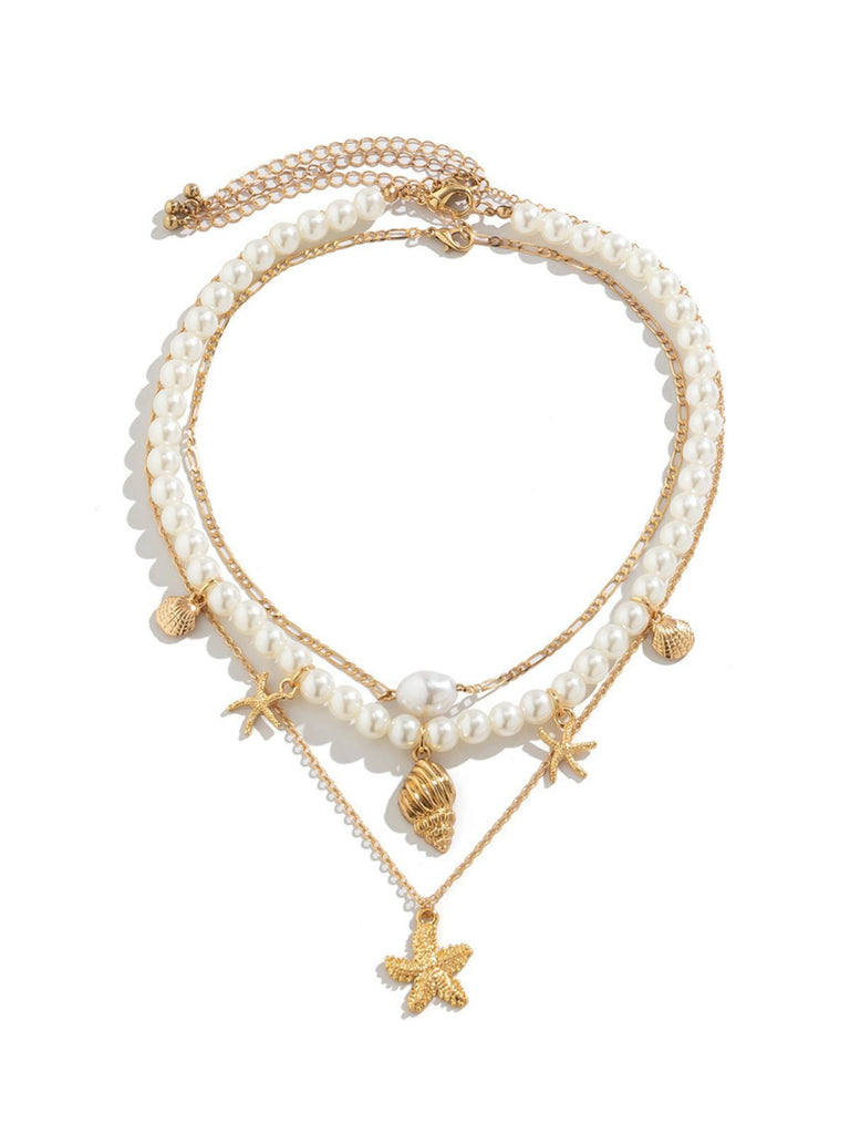 Collier chaîne superposée en perles coquillages et étoiles de mer