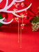 Boucles d'oreilles pendantes rouges Père Noël