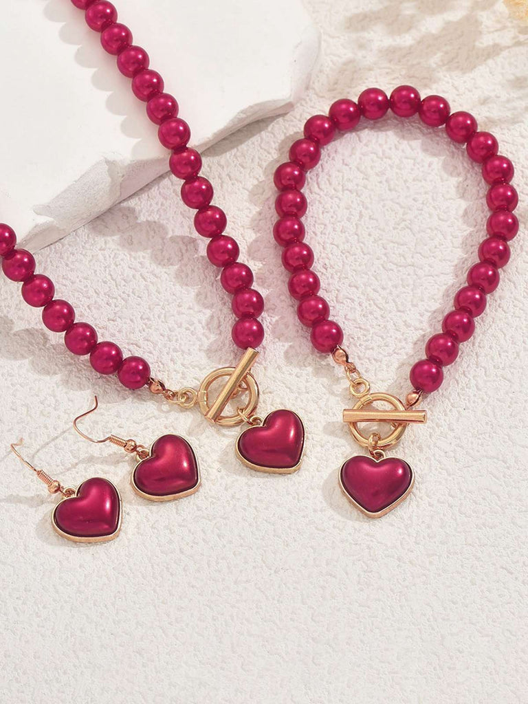Ensemble collier bracelet et boucles d'oreilles vintage en perles en forme de cœur