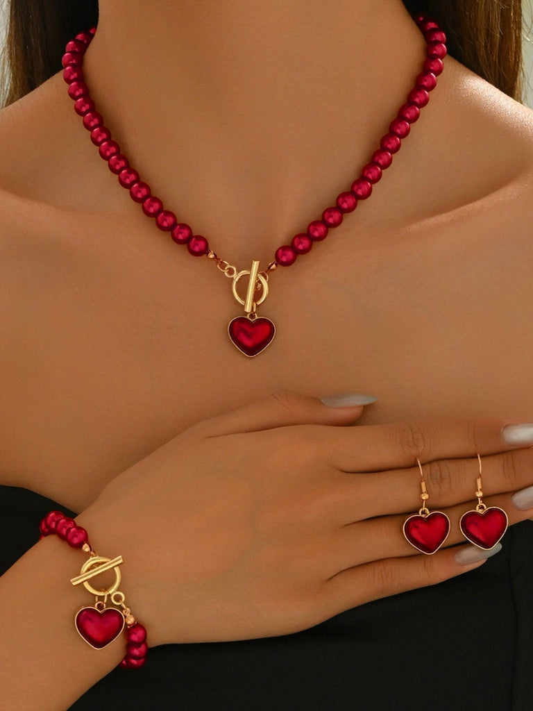 Ensemble collier bracelet et boucles d'oreilles vintage en perles en forme de cœur