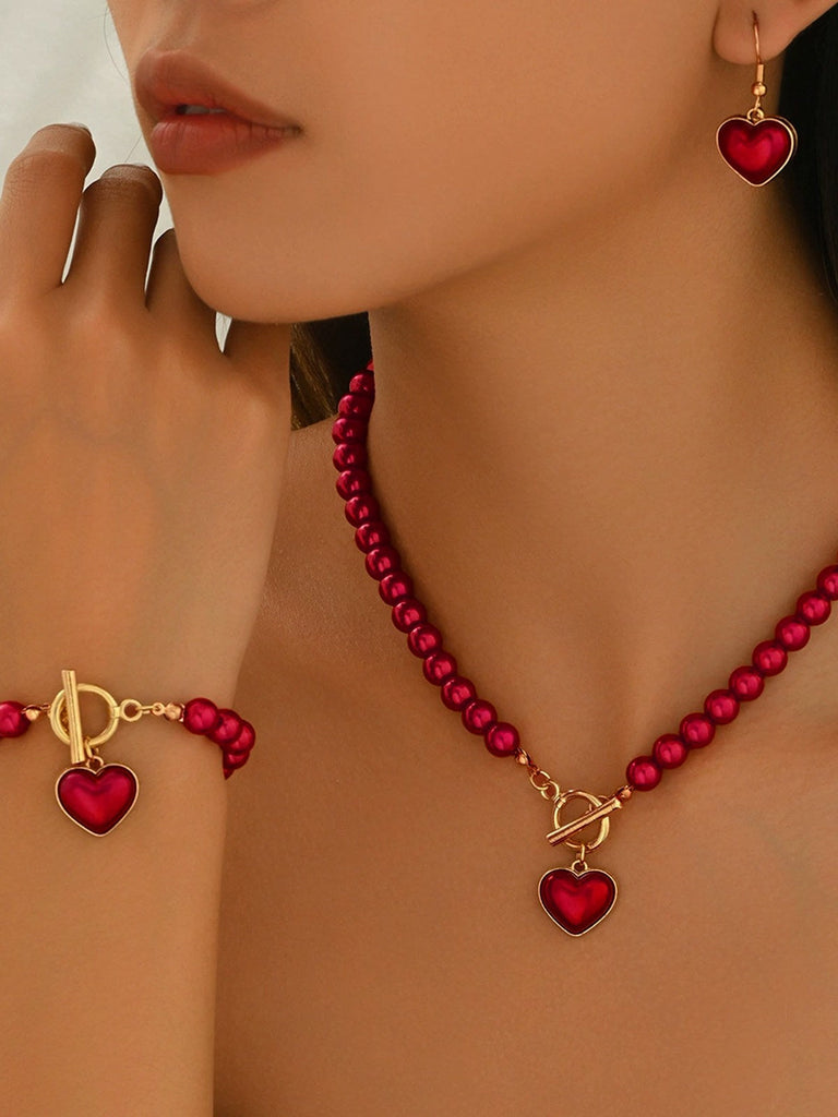 Ensemble collier bracelet et boucles d'oreilles vintage en perles en forme de cœur