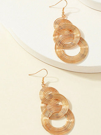Boucles d'oreilles vintage en alliage doré à spirale exagérée