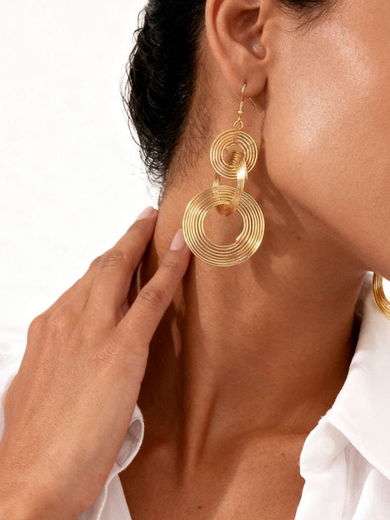 Boucles d'oreilles vintage en alliage doré à spirale exagérée