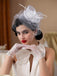 Chapeau bibi à plumes florales avec voile