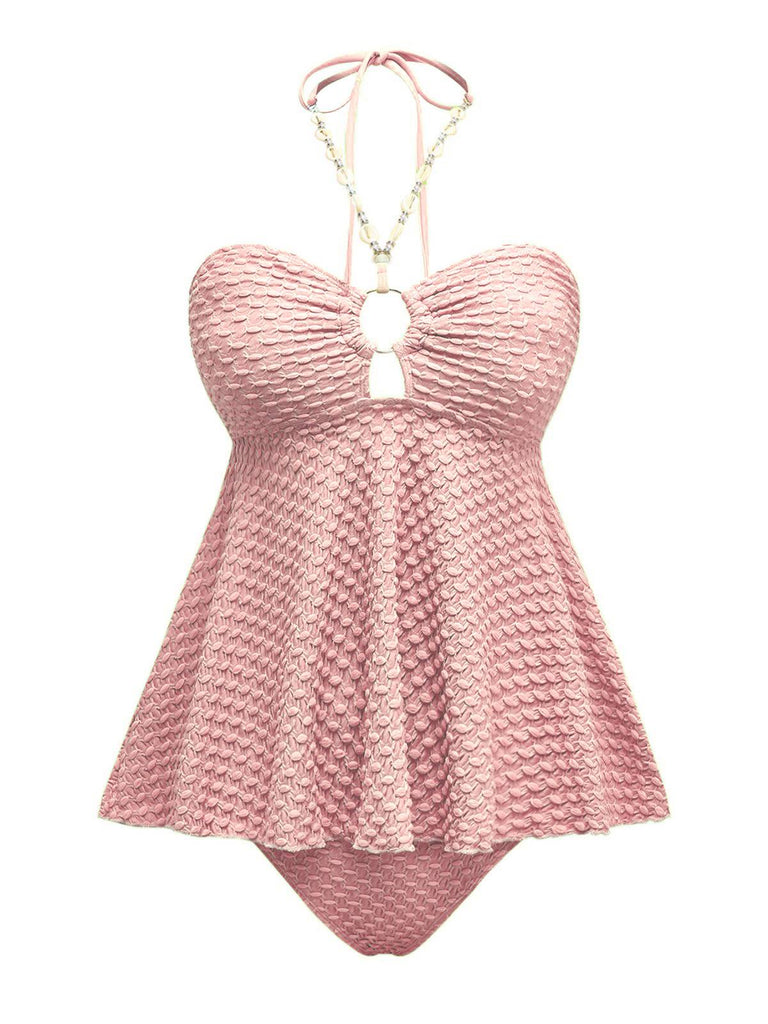 Maillot de bain dos nu à lacets et chaîne coquillages des années 1940