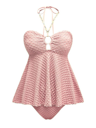 Maillot de bain dos nu à lacets et chaîne coquillages des années 1940