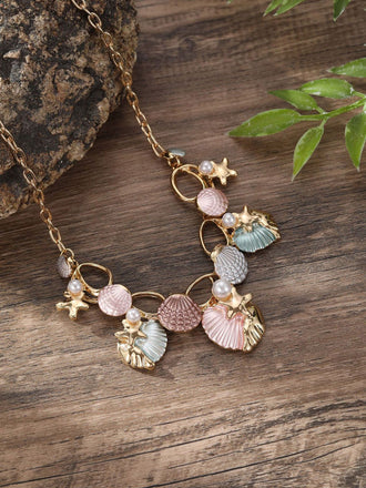 Necklace with shell and starfish charms on a wooden surface
