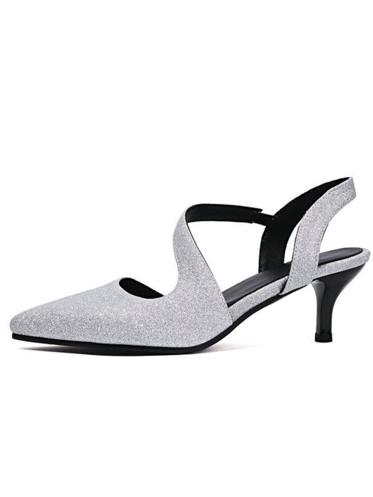 Silver glitter high-heeled shoes with black straps on a white background