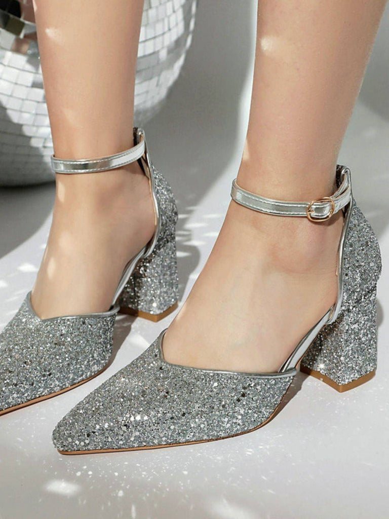Silver glitter high heels on a neutral background