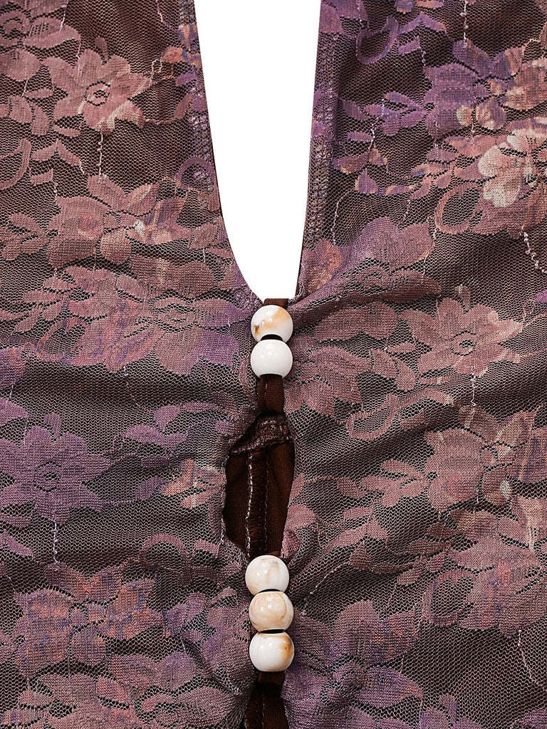 Close-up of the front keyhole cut-out decorated with delicate white and gold beads on the purple lace fabric.