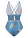 Blue and gold patterned swimsuit with criss-cross straps on a white background