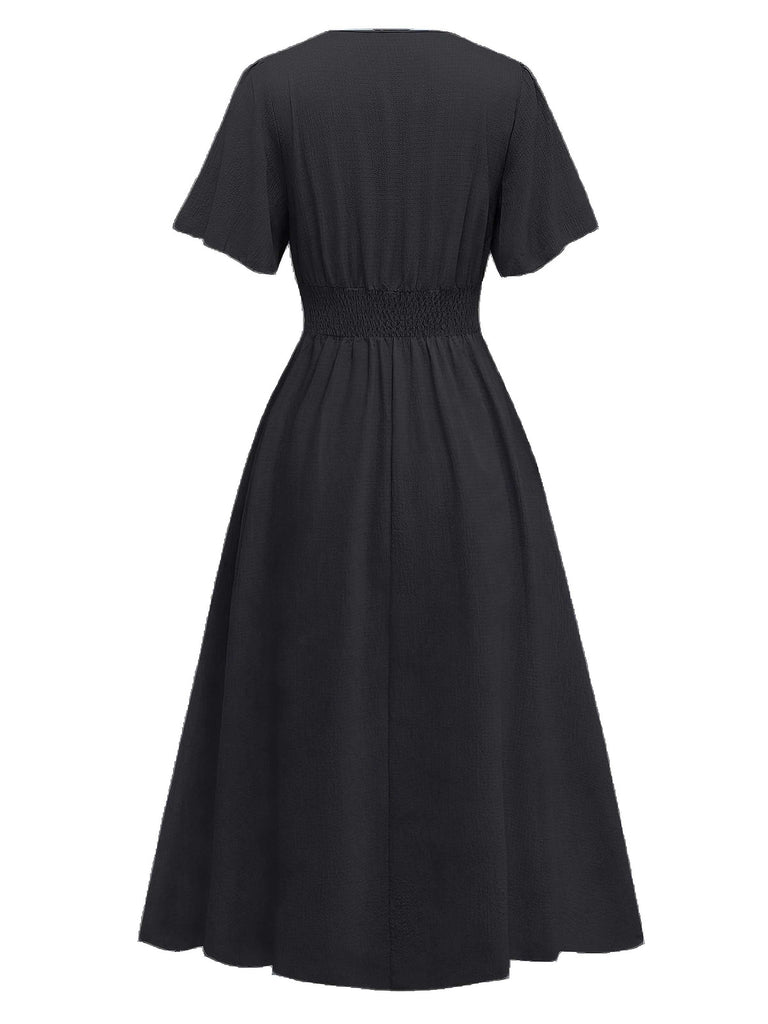 Robe noire manches volants froncée fendue col V années 1940