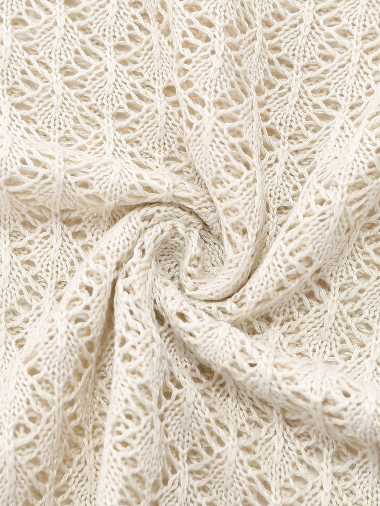 Macro view of the intricate knit pattern and breathable fabric texture of the crochet beach dress.