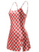 Side-angled view of the red and white checkered satin dress highlighting the short side slit and the glossy finish of the fabric.