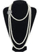 A Great Gatsby style long multi-strand pearl necklace displayed on a black mannequin, highlighting its elegant drape.