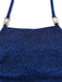 Close-up of the square neckline and gold-tone hardware on the shimmering navy blue fabric.