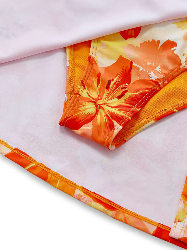 Floral fabric with orange and yellow flowers on a white background