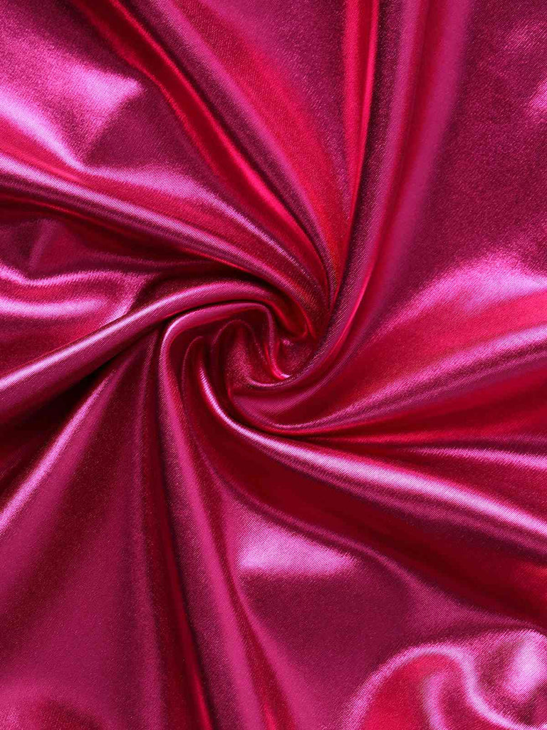 Close-up of pink satin fabric with folds