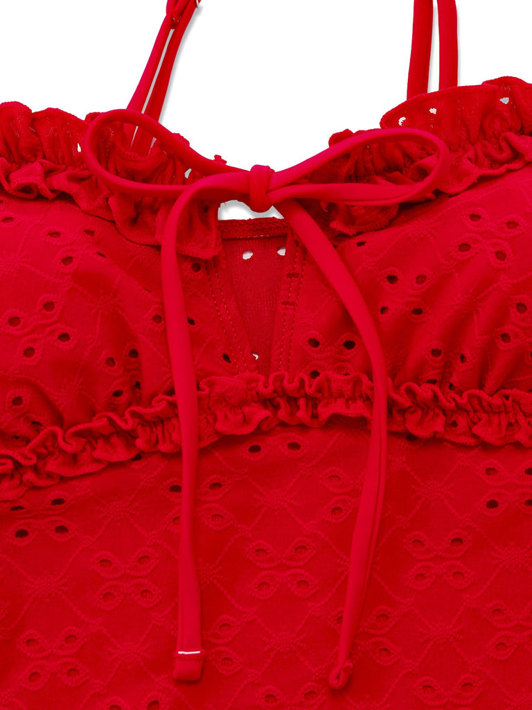Red tankini-top with ruffled details on a white background