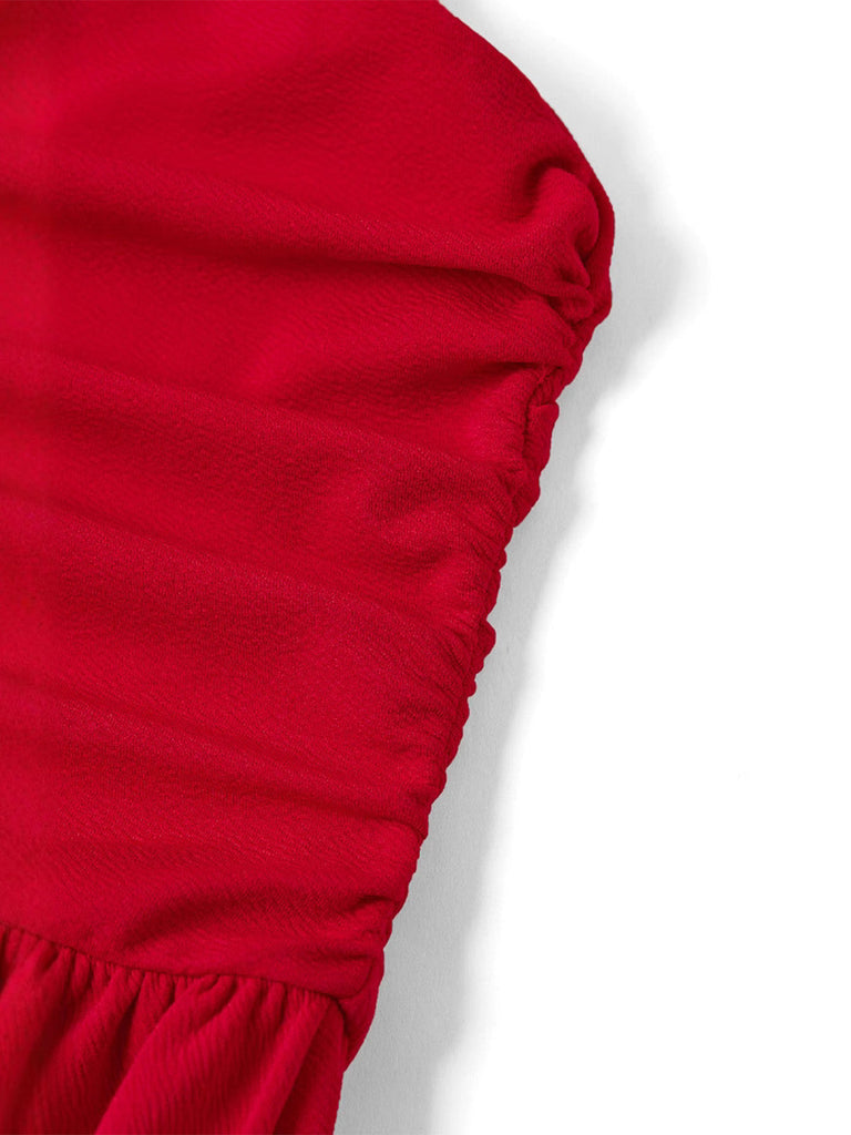 Detailed shot of the horizontal ruching and pleated fabric on the bodice of the red vintage dress.