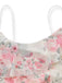 Close-up of the delicate white spaghetti strap and the layered ruffle detail on the dress neckline.