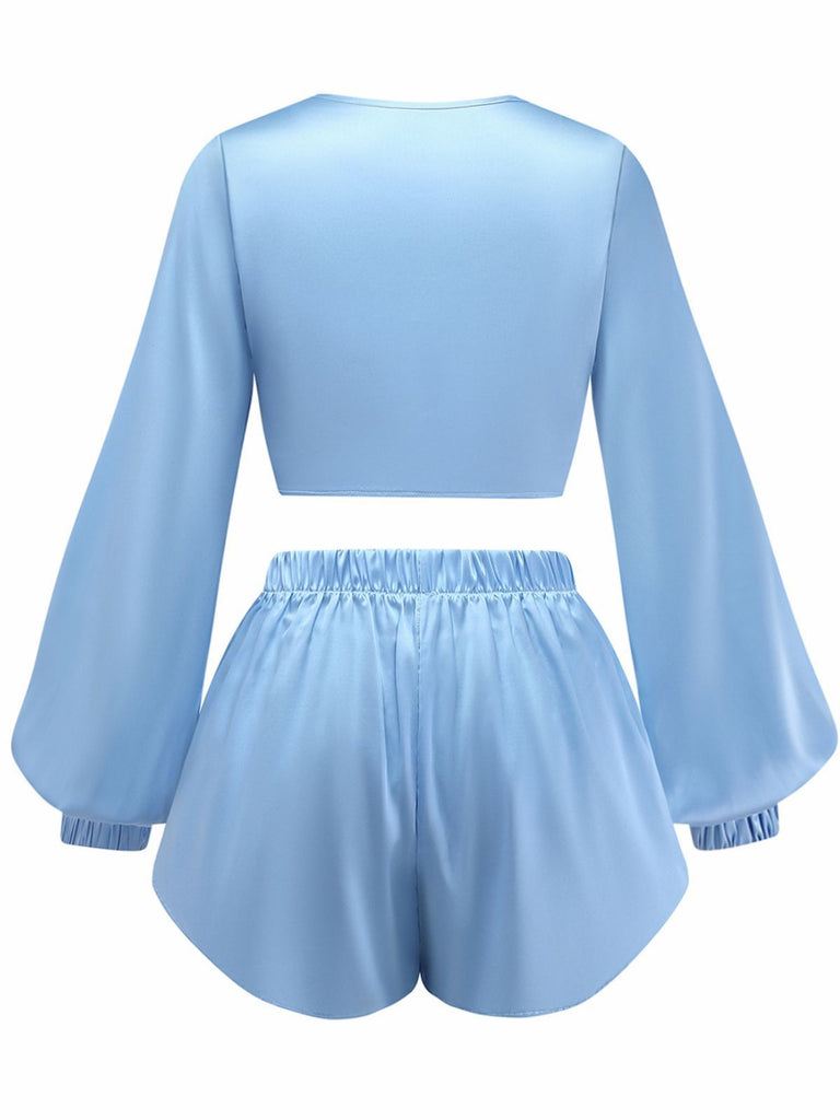 Back view of the light blue satin lounge set, highlighting the loose fit and comfortable elastic waistband on the shorts.