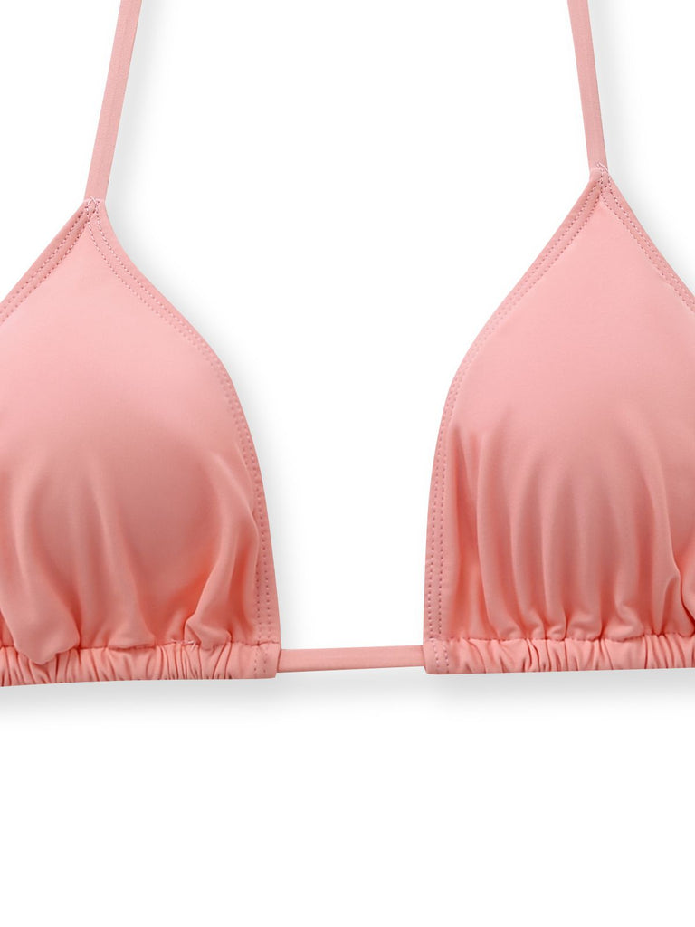 A detailed view of the simple pink triangle bikini top included in the 3-piece set.